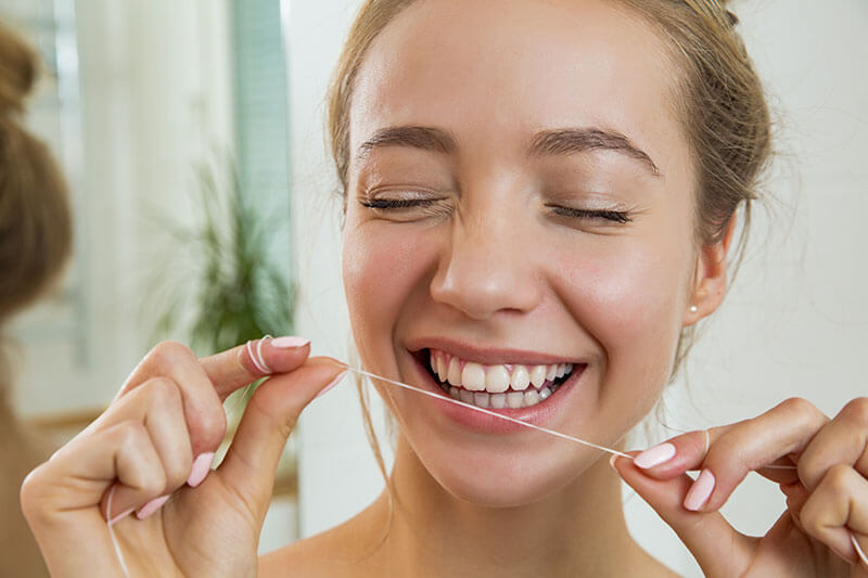 woman flossing